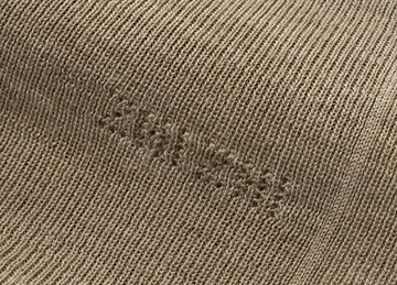 Seamless Wool Mockneck in Warm Grey Beige - detail knitted signature - Warm Grey Beige