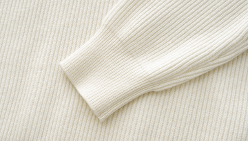 Luohuachao Embroidered Wool Turtleneck Sweater in Ivory White - Ribbed cuff detail