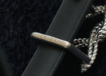 Baixingyueman Signature Slim Leather Belt in Ink Black - detail engraved buckle underside - Ink Black