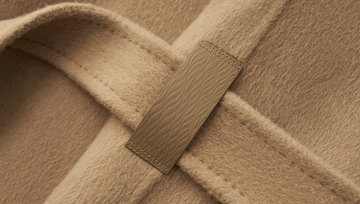 Ting Feng Yu coat in Frosted Apricot Camel - Leather belt tab and stitching